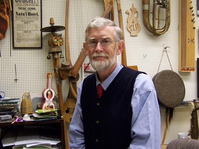 James Kimball in a room full of instruments.