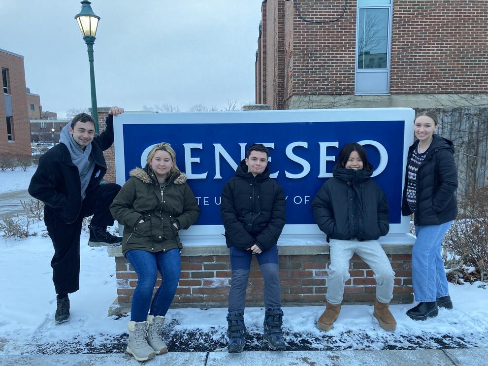 Five students stand in front of SUNY Geneseo sign