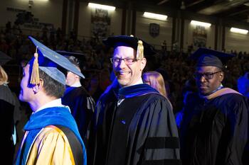 Faculty in graduation regalia