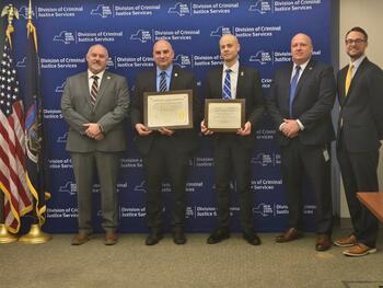 (From left to right) DCJS Deputy Commissioner Michale Bonse; Scott Ewanow, chief, and Erik Petersen, inspector, SUNY Geneseo University Police Department; New York State University Police Deputy Commissioner Richard Bialkowski; and DCJS Executive Deputy Commissioner Joseph Popcun