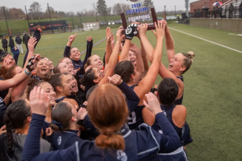 The women's field hockey team celebrates their title
